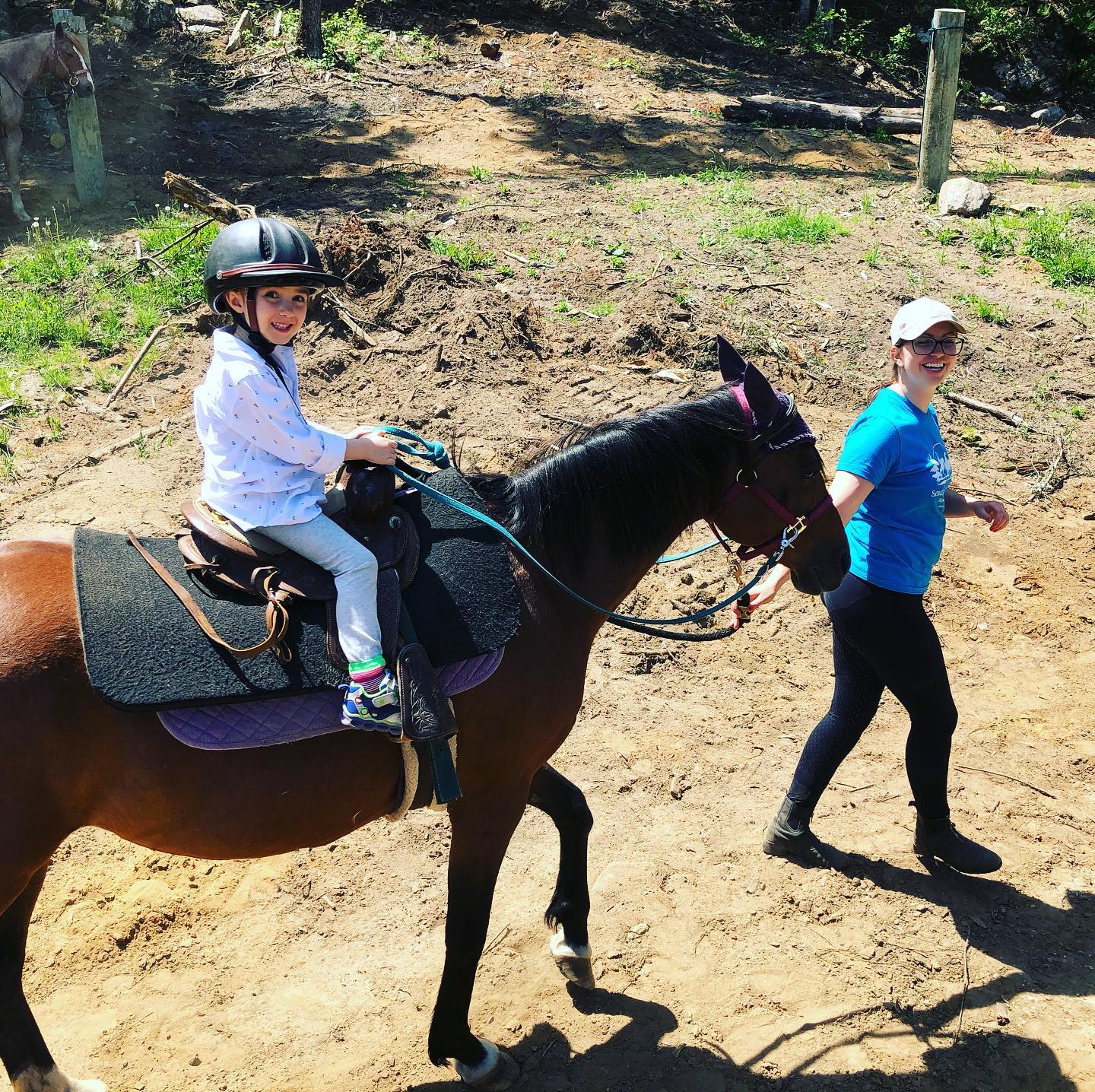 An experienced guide and instructor enjoy the "Saddle Up" horse camp at South Algonquin Trails